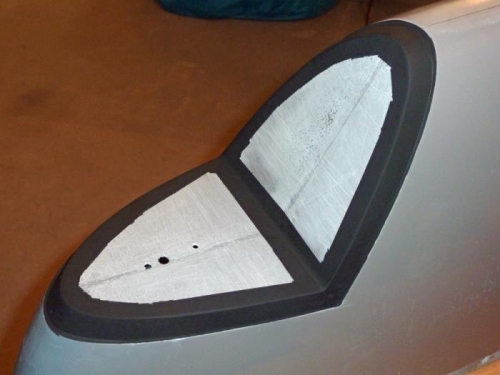 Wingtip light reflectors will be bonded to the fiberglass, with the black showing around the edges.