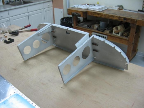 Sub panel with seal depressor riveted