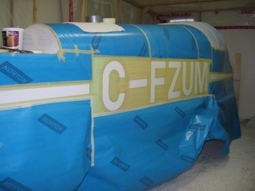 Fuselage masked for accent strip and registration mark painting