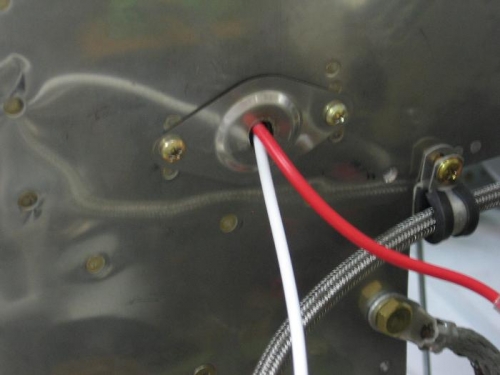 Installed firewall shields for both main alternator and essential alternator main feed cables