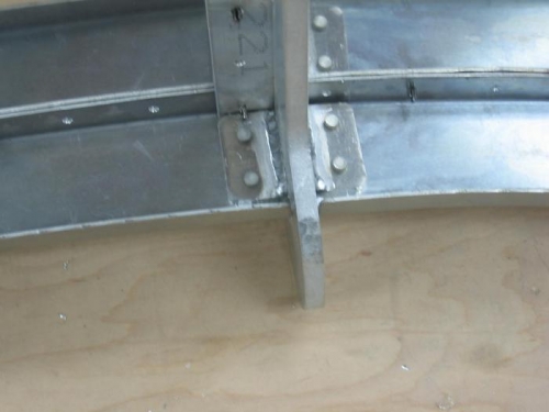 Forward canopy hinge arm tabs drilled and rivet to the C channel