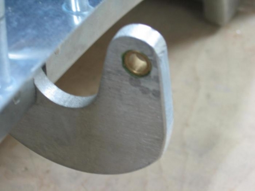 Forward canopy frame hinge drilled and bushing installed