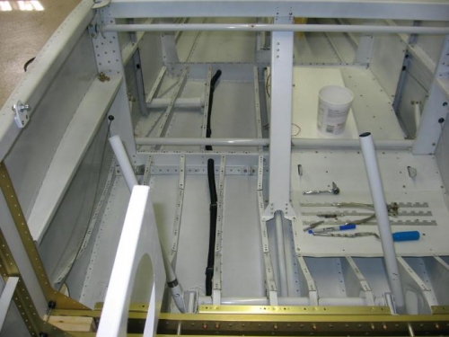 Wiring conduit installed under the cabin and baggage area floors