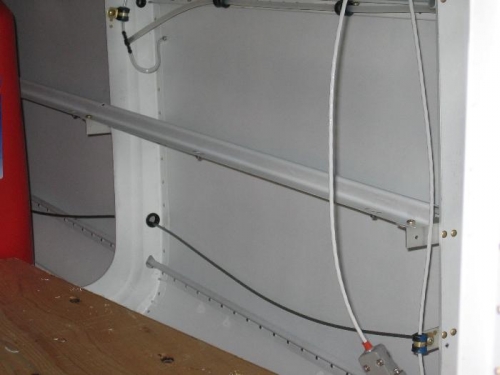 Aft fuselage wiring harness support rail installed