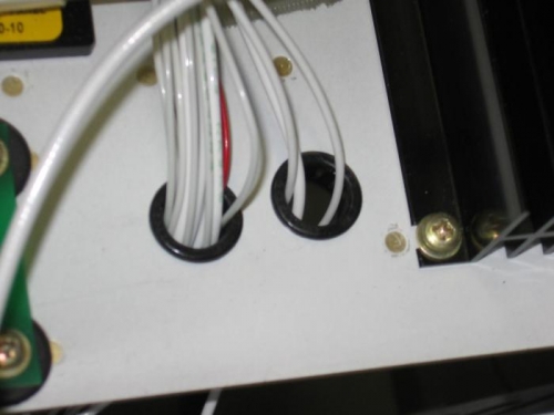 Supplemental wiring harness snap bushings installed