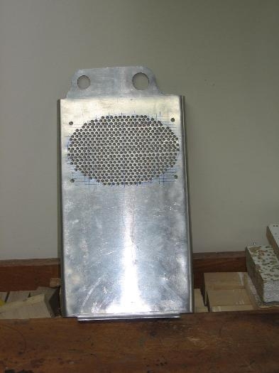 Instrument panel extension drilled for the speaker