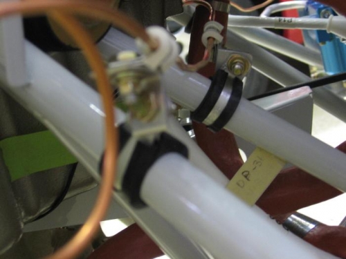 Primer line leading to #4 cylinder clamped to engine mount