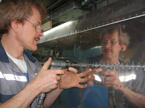 Match drilling the left flap to the wing