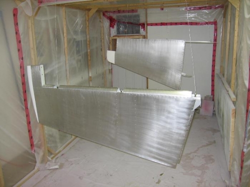 Rudder and vertical stabilizer cleaned, etched and abraded in preparation for priming