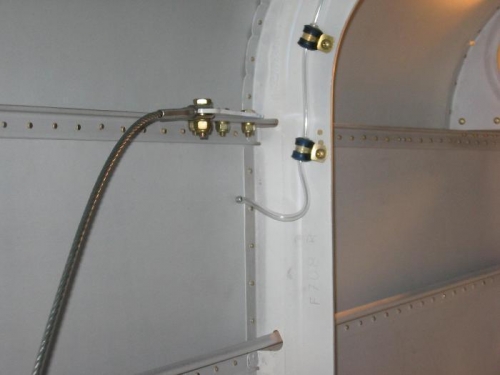 Seat belt upper attach point cable installed