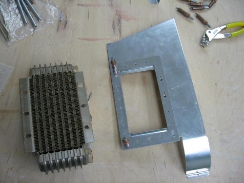 Aft left engine baffle prepared for the oil cooler installation