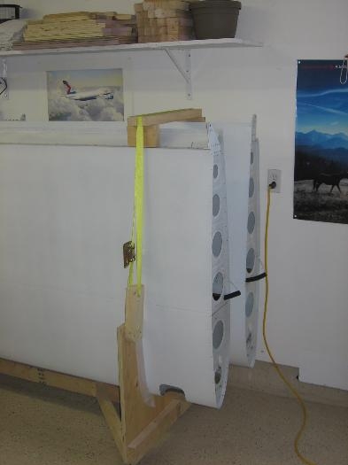 Wings secured to the wing cradle in preparation for shipping to the airport