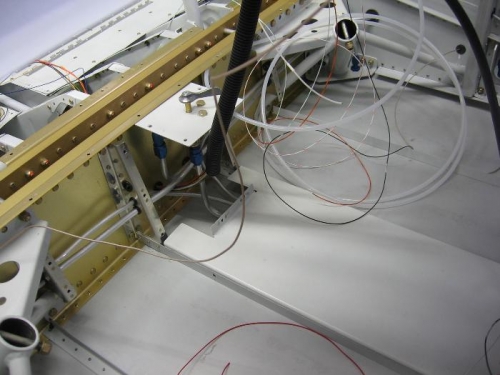 Wire routing through the spar