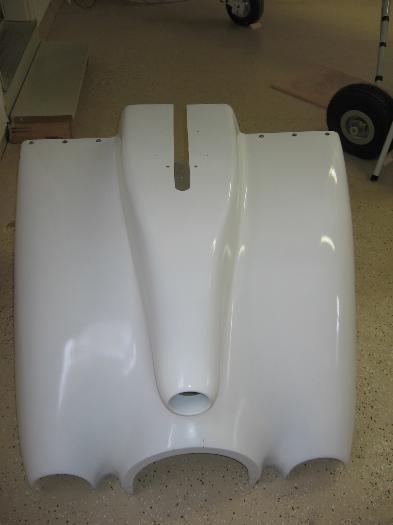 Lower cowling gear leg slot filler plate fabricated