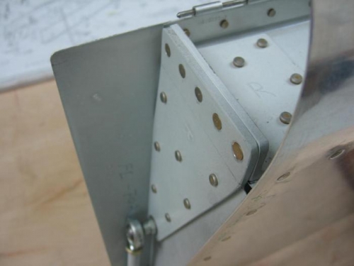 Flap end fitting with AN426 rivets installed
