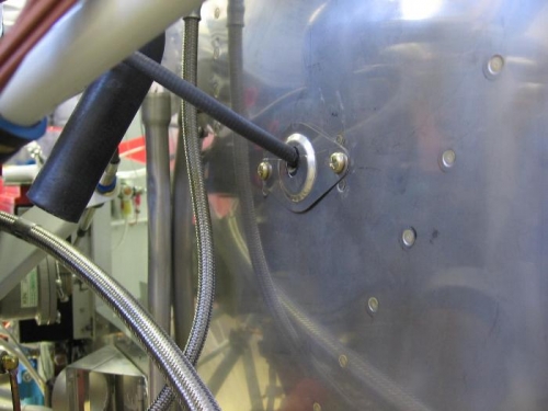 Prop control cable firewall shield installed