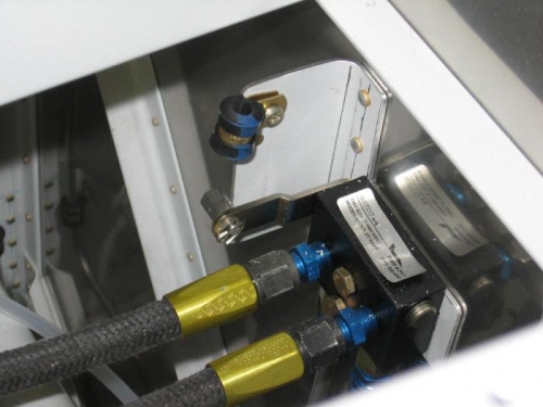 Park brake valve bracket anchor nut and clamp installed to secure the control cable