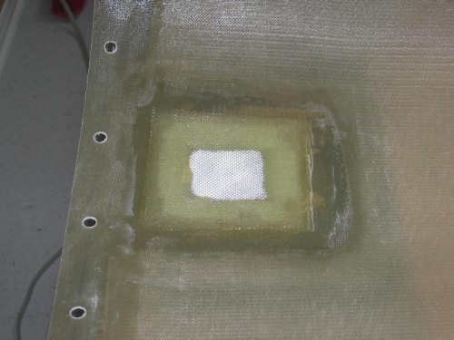 Oil filler door back up ring bonded on