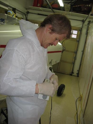 Suited up and setting the clock in preparation for painting