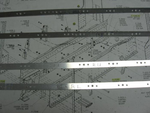 Wing tip fairing anchor nut retainer strips drilled for anchor nut rivet holes