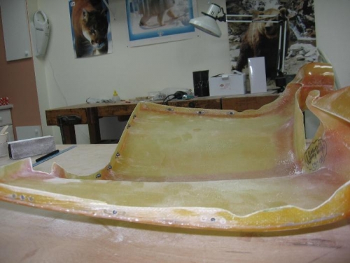 Engine cooling plenum drilled to the engine cooling baffles and nut plates riveted on