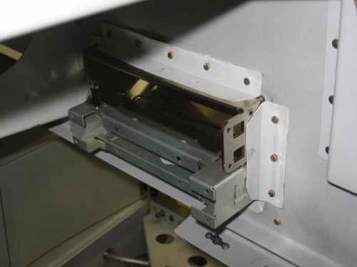 Subpanel radio tray support angles riveted on
