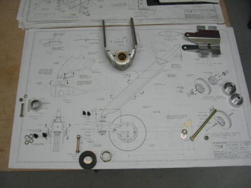 Axle adapters, nose wheel fork, wheel fairing brackets and attaching hardware