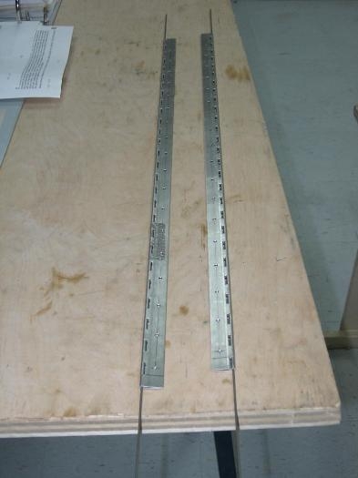 Gear leg fairing hinges cut to length and drilled