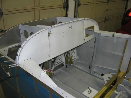 Sub panel assembly riveted into the fuselage