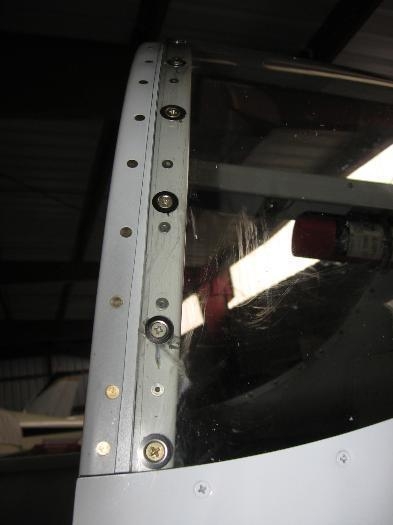 Aft window forward edge holes enlarged and washers installed