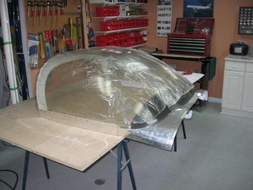 Plexiglass screwed to canopy frame