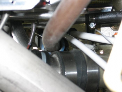 Propeller oil supply line, alternator and starter cables clamped