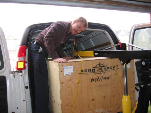 Hoisting the crate from the van