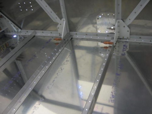 F-722B forward fuselage floor stiffener installation