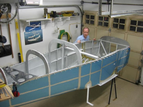 With riveting completed the fuselage is turned upright