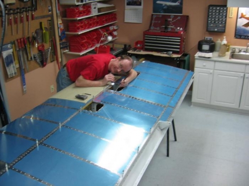 The right wing lower skin riveting in progress
