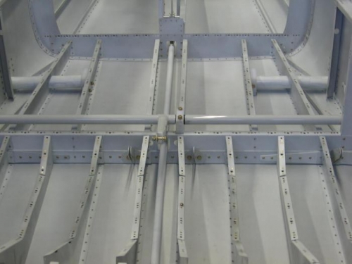 Cabin and baggage floor rib anchor nut installation