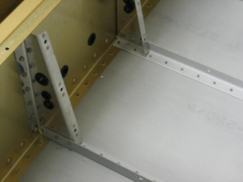 Forward cabin cover supports riveted