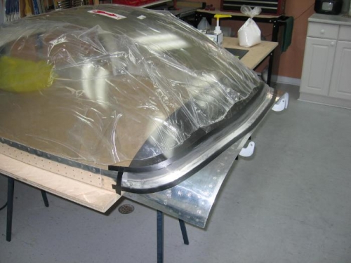 Taping off area to be fiberglassed and abrading the surface