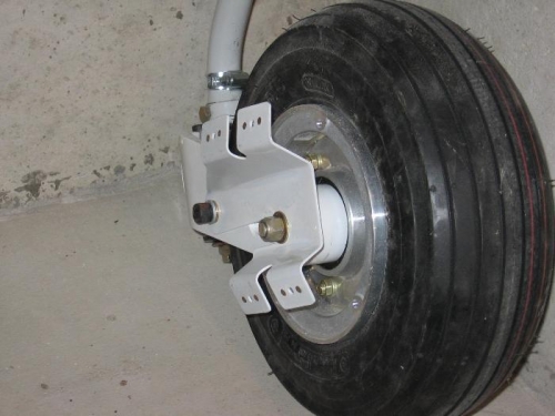 Nose gear wheel fairing support brackets installed