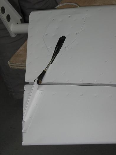 Elevator tab hinge pin safetied and tab control rod installed