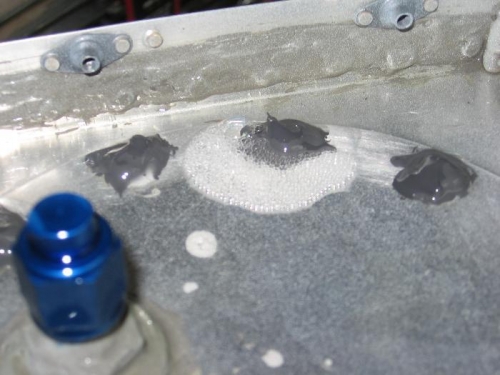 Two minor leaks found on the tank access panel retaining screws