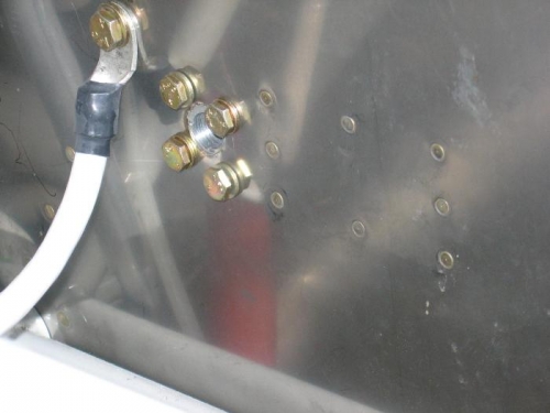 Fuel system firewall fitting mounting blocks modified to four bolt retention