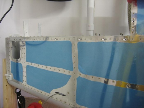 Horizontal to vertical stab fairing retaining screw anchor nuts installed