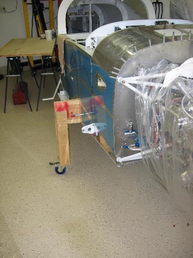 Fuselage temporary support legs raised for cowling installation