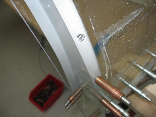 Canopy retaining screw holes countersunk and drilled to final size