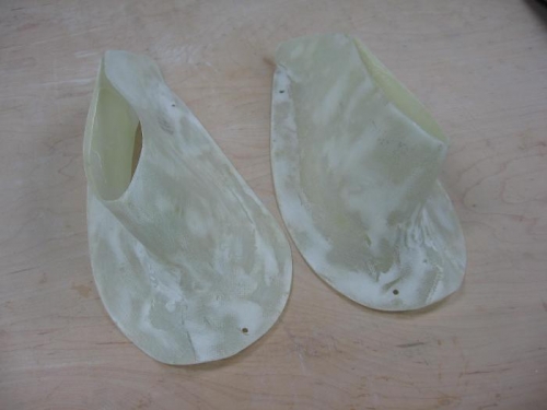 Main gear leg upper intersection fairings sanded after micro application