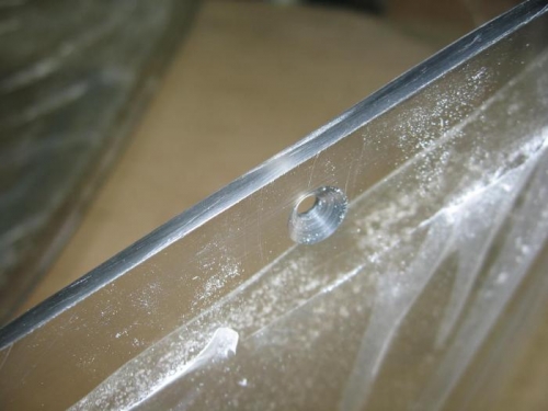 Screw holes drilled to final size and countersunk and edge finishing carried out