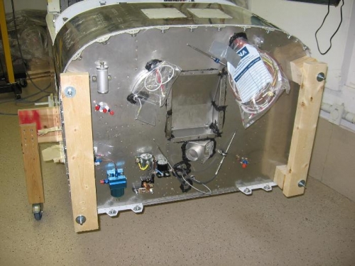 Fuselage support fixture installed on the firewall