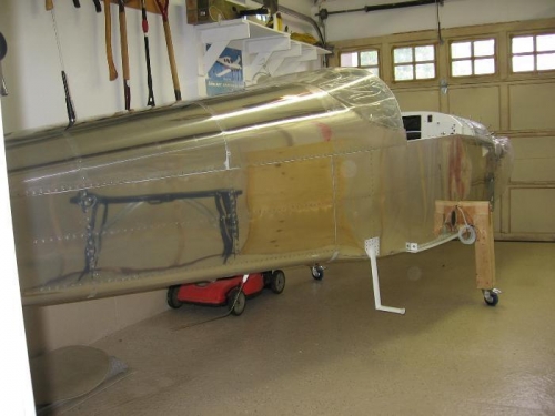Fuselage aluminium vinyl covering removed